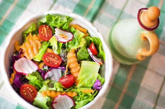 Colorful fresh vegetable salad with cherry tomatoes, radishes, and leafy greens in a bowl