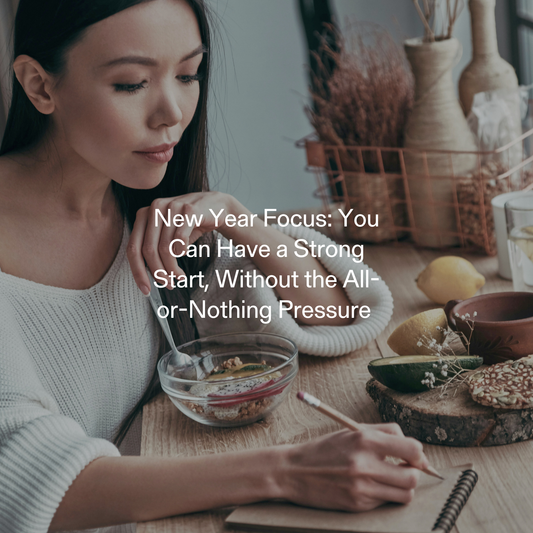 Woman journaling while eating a healthy breakfast with Calocurb, embracing a mindful New Year routine without all-or-nothing pressure