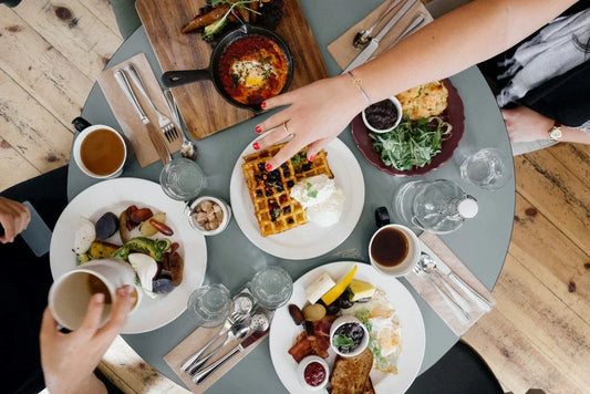Group enjoying diverse brunch with appetite control and food noise awareness support