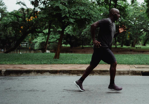 Active man running outdoors to support metabolism and weight loss