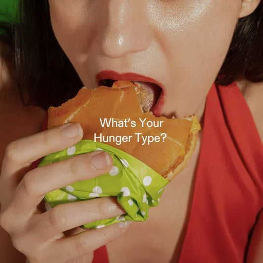Woman eating burger – visual representation of emotional and physical hunger types