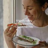 Smiling woman eating healthy snack – mindful eating paired with natural GLP-1 support from Calocurb
