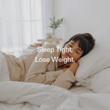 Woman sleeping peacefully in bed, highlighting the link between quality sleep, appetite hormones, and weight loss