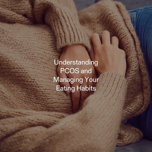 Woman experiencing PCOS symptoms with hands on abdomen, highlighting emotional and physical challenges of managing appetite