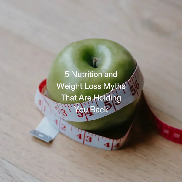 Green apple wrapped in measuring tape, illustrating common weight loss myths and diet misconceptions